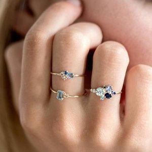 RINGS MULTI COLORS OF BLUE AND CLEAR ZIRCONS SET